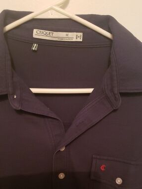 Criquet Navy Button-Up Polo with Small Red Chest Logo